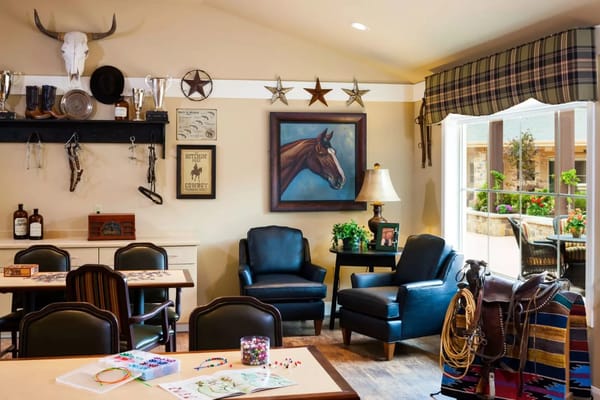 Comfortable seating and decor in the common area with western themes.