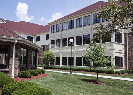 Exterior view of the building with landscaped grounds