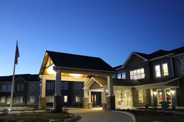Exterior view of Rock Creek Senior Living at dusk
