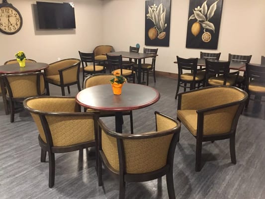 Common area with seating and decorative wall art