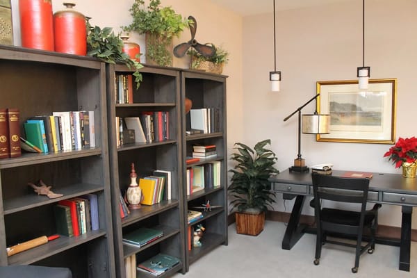 Cozy reading nook with bookshelves and desk