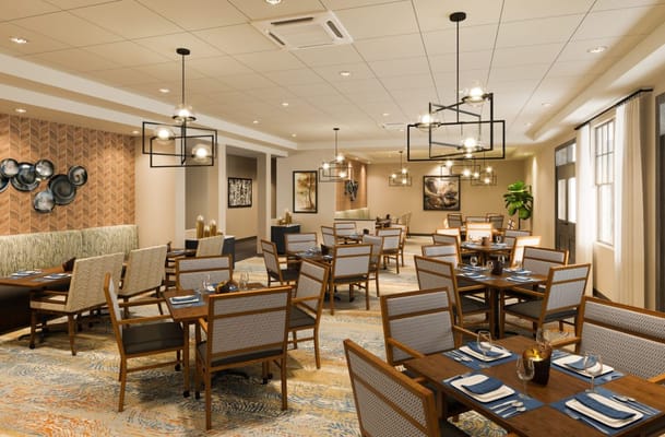 Modern dining room with tables set for meals