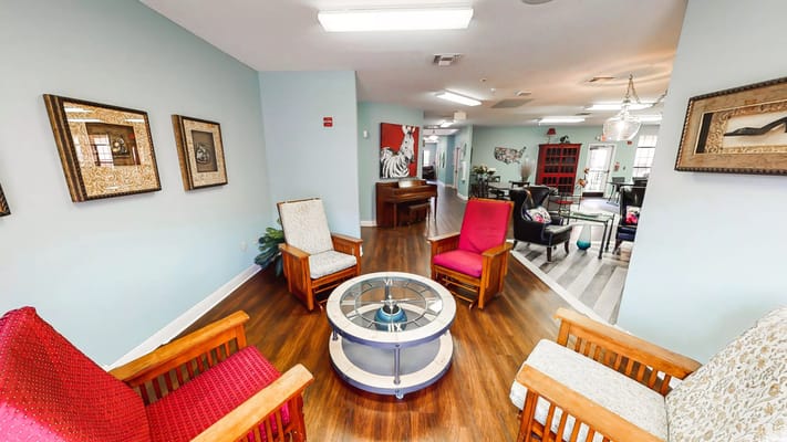 Cozy common area with seating and piano