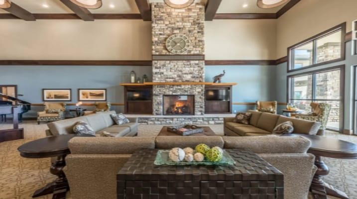 Cozy living room with stone fireplace and seating area