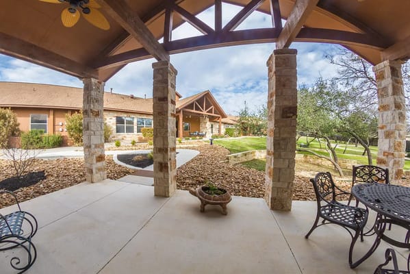 Outdoor patio view with landscaping at Rocky Hollow Lake House