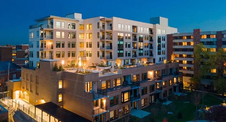 Exterior view of the Roland Park Place residential facility at night
