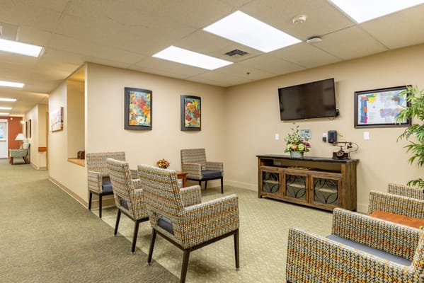 Bright interior common area with seating and decor