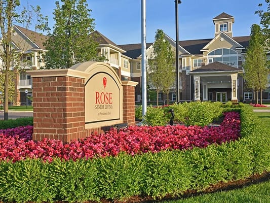 Exterior view of Rose Senior Living with landscaped grounds