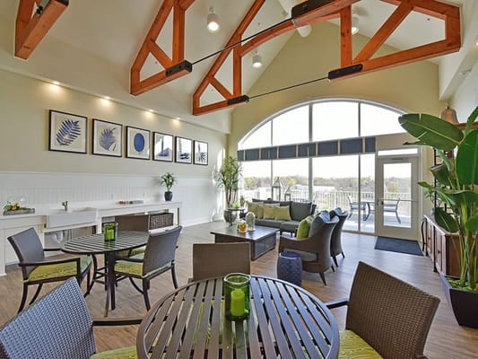 Bright common area with comfortable seating and large windows