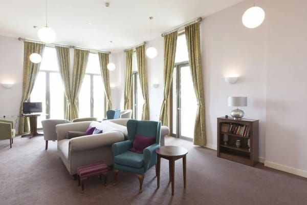 Stylish living room with modern furniture and large windows