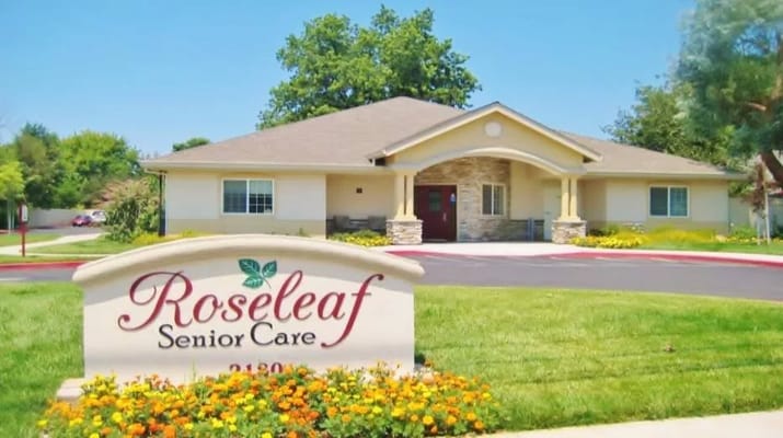 Sign for Roseleaf Senior Care with the facility building in the background