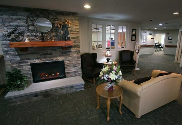 Comfortable seating area with fireplace and decorative elements