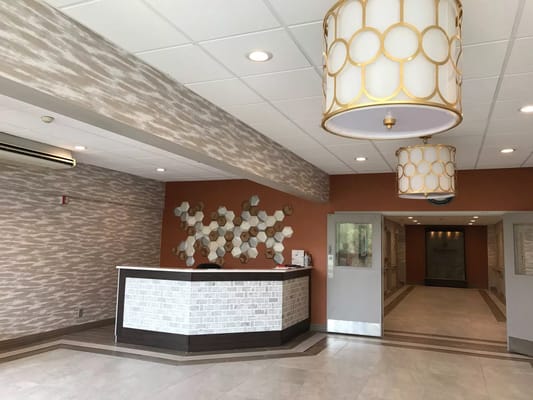 Bright lobby area with modern decor and reception desk