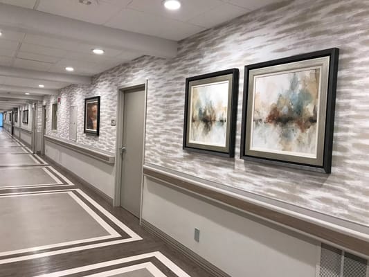Bright hallway with artwork on the walls
