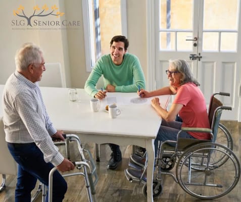 Residents and staff engaging in conversation in a communal area