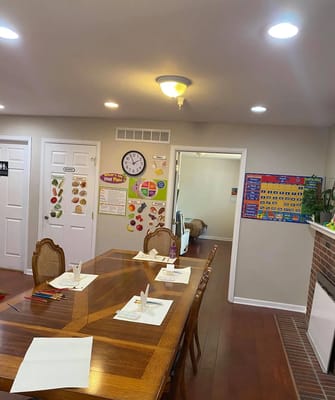 Dining room setup with a large wooden table