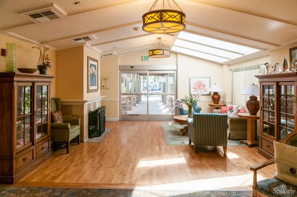 Warm and inviting lobby area with seating and natural light.