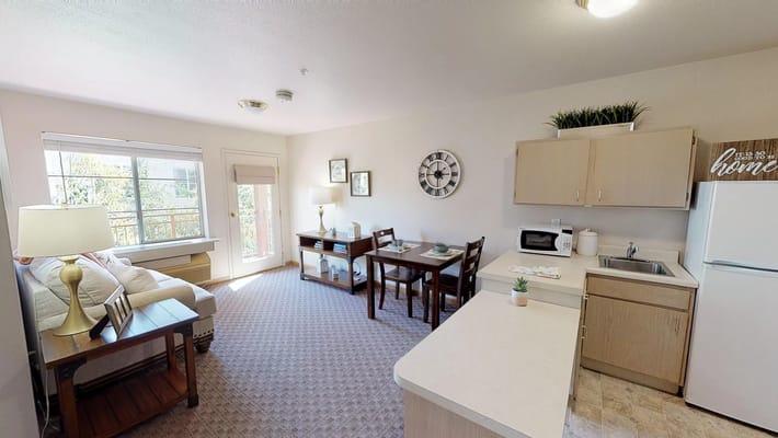 Cozy interior of a resident's living area with kitchen