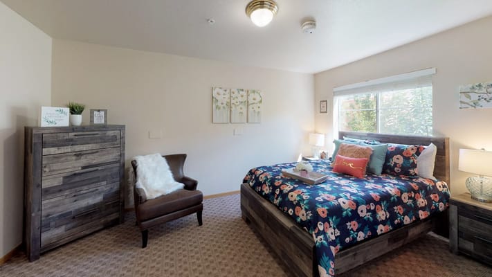 Cozy private room with floral bedding and natural light