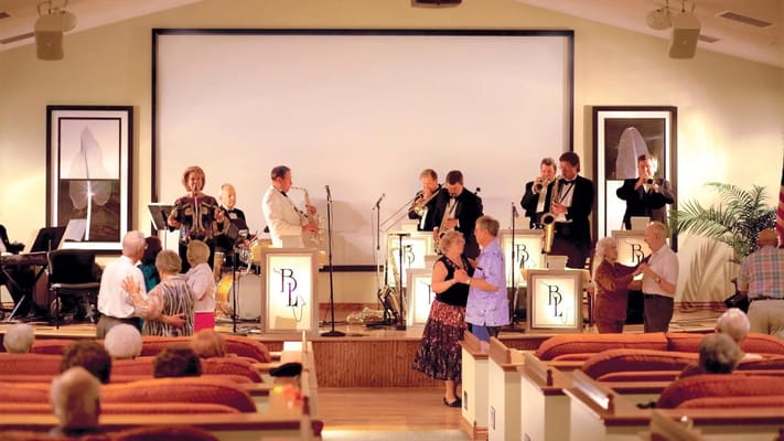 Seniors dancing to live music at Sable Lodge Retirement Community