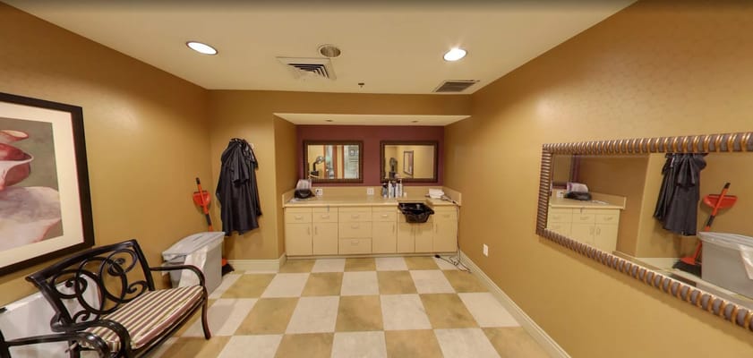 Beauty room featuring a vanity and mirrors