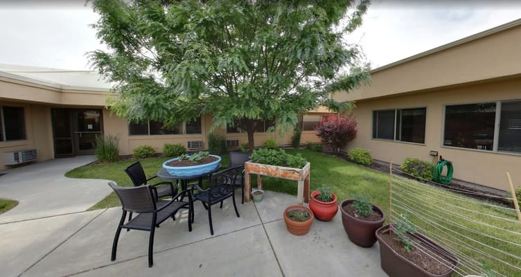 Seating area in the outdoor garden with planters