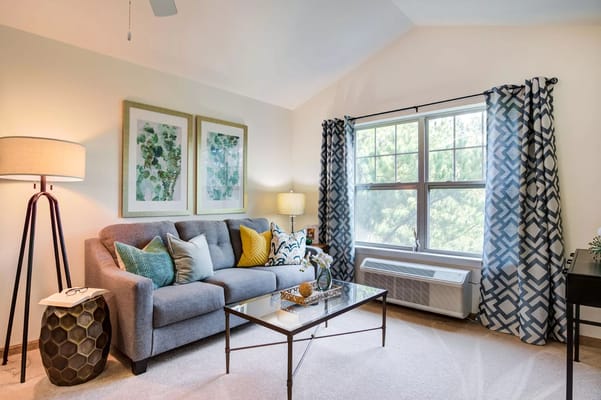 Modern living room with a sofa, lamp, and decorative elements