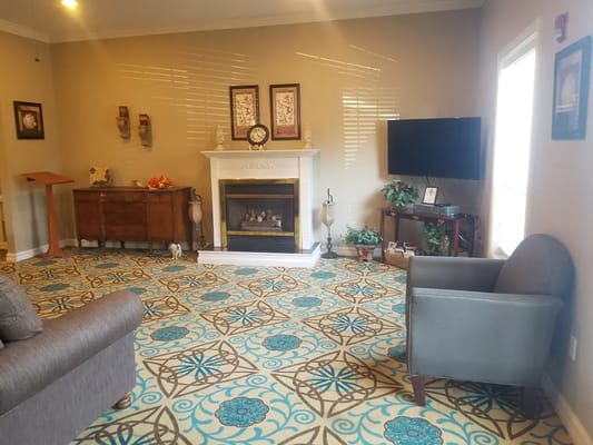 Cozy living room with a fireplace and a decorative rug
