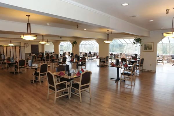 Interior view of a dining room with tables and chairs