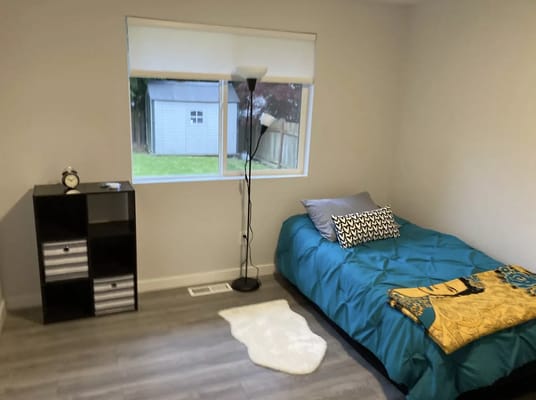 Cozy resident room with bed and storage