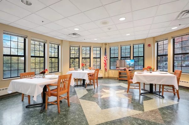 Bright dining area with tables and chairs