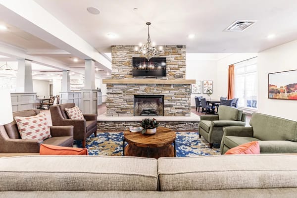 Cozy lounge area with comfortable seating and a fireplace