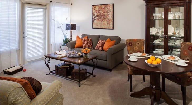 Cozy living room with a sofa, dining area, and decor