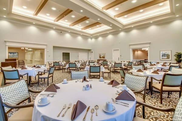 Elegant dining area with set tables at Discovery Village