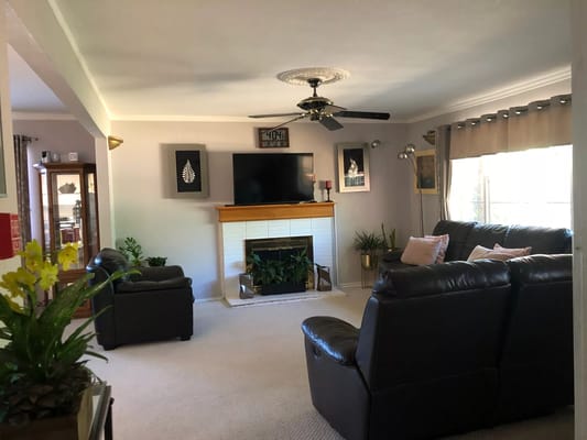 Spacious living room with comfortable seating and natural light
