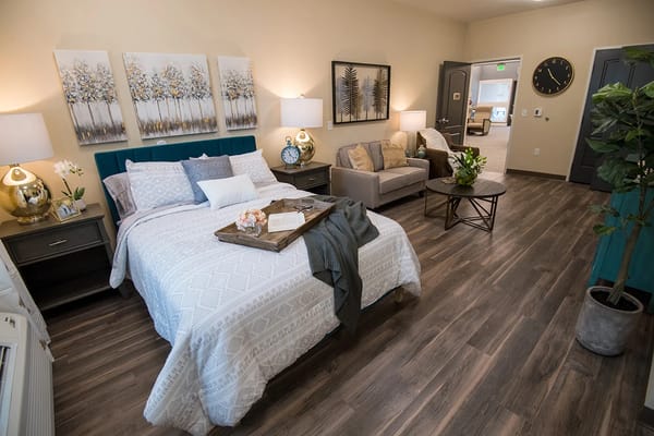 Cozy resident room with bed and seating area