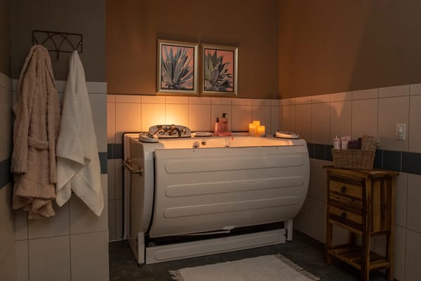 A well-designed bathroom with a bathtub and decor
