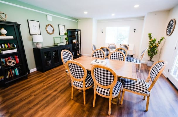 Elegant dining room with checkered chairs and wooden table