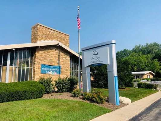 Exterior view of Sheridan Health and Rehabilitation Center with signage