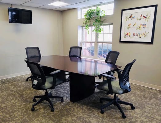 Conference room with a table and chairs