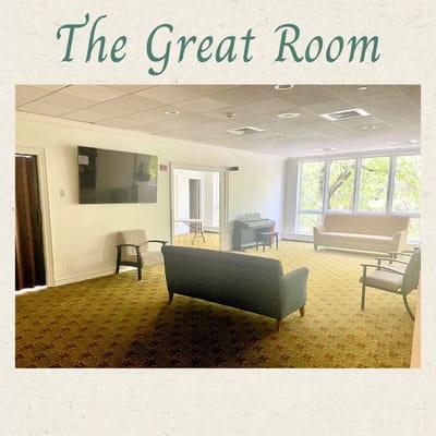 Spacious common area with seating and a television