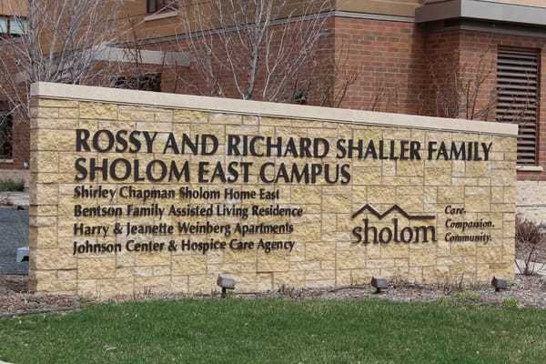 Sign displaying the name and offerings of Shirley Chapman Sholom Home East.