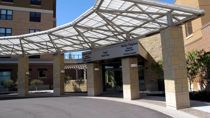 Main entrance of Shirley Chapman Sholom Home East with canopy.