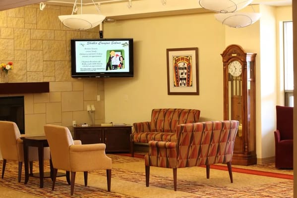 Cozy living room with seating and a clock