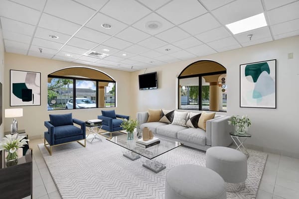 Modern lobby featuring comfortable seating and large windows