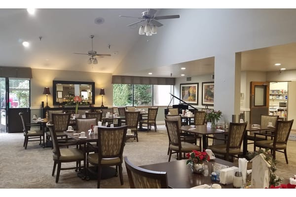 Dining room with tables set for residents