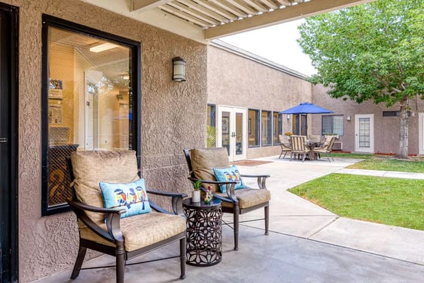 Chairs and table on the patio of Sierra Vista Independent & Assisted Living.