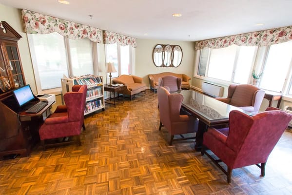 Interior common area with seating and a library