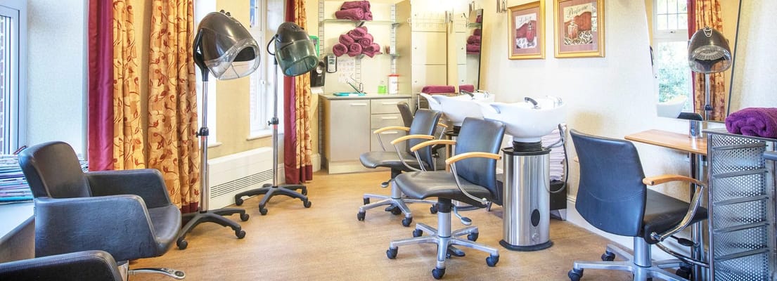 Hair salon with styling chairs and shampoo stations