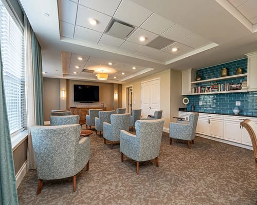 Common area with seating and TV at Silver Comet Village